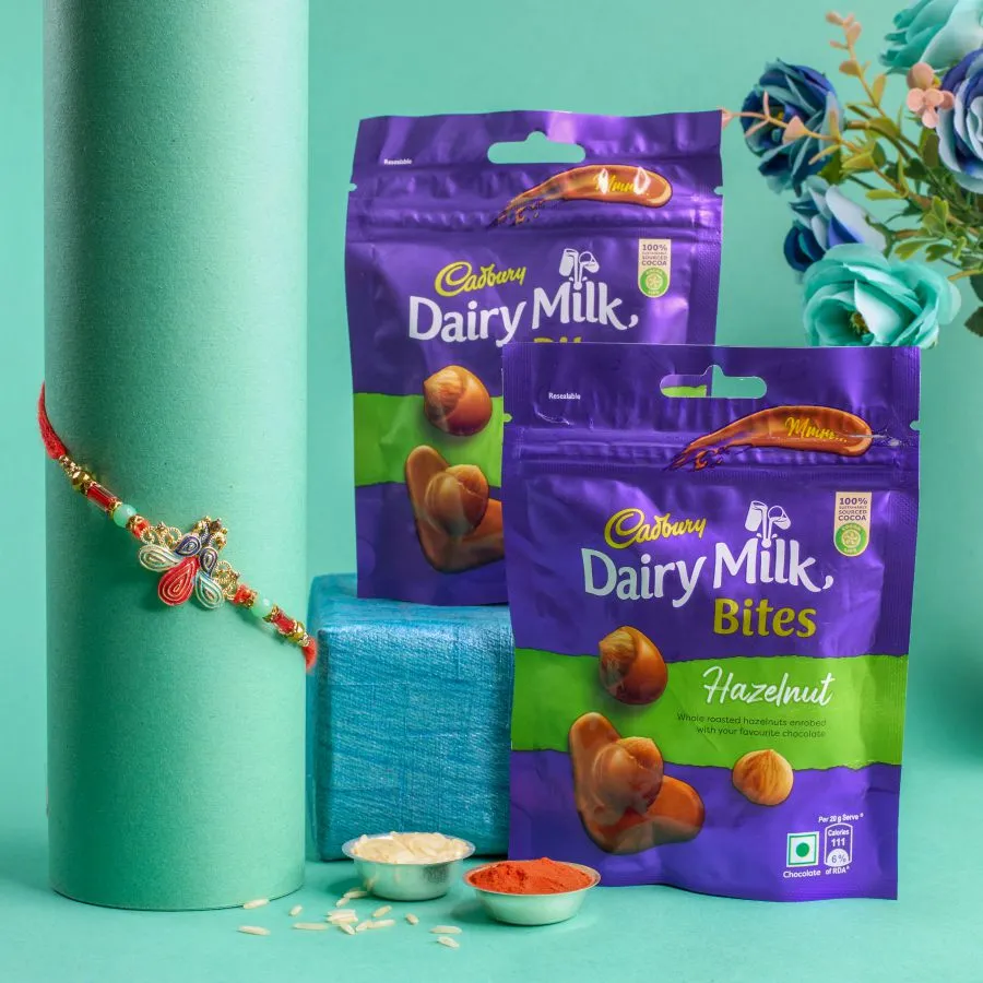 Vibrant Peacock Rakhi & Hazelnut Treats