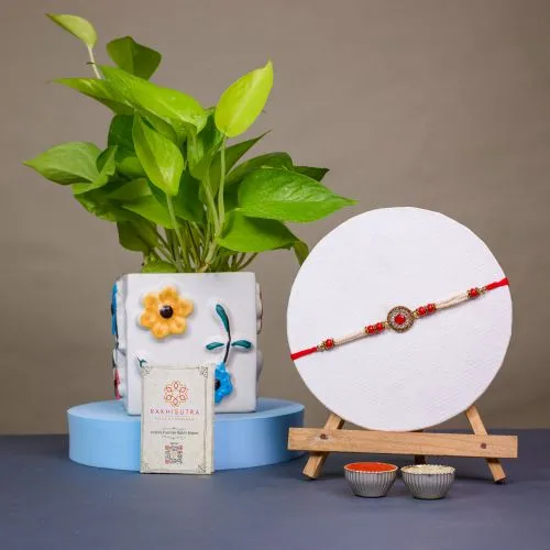 Elegant Kundan Rakhi with Golden Pothos 1