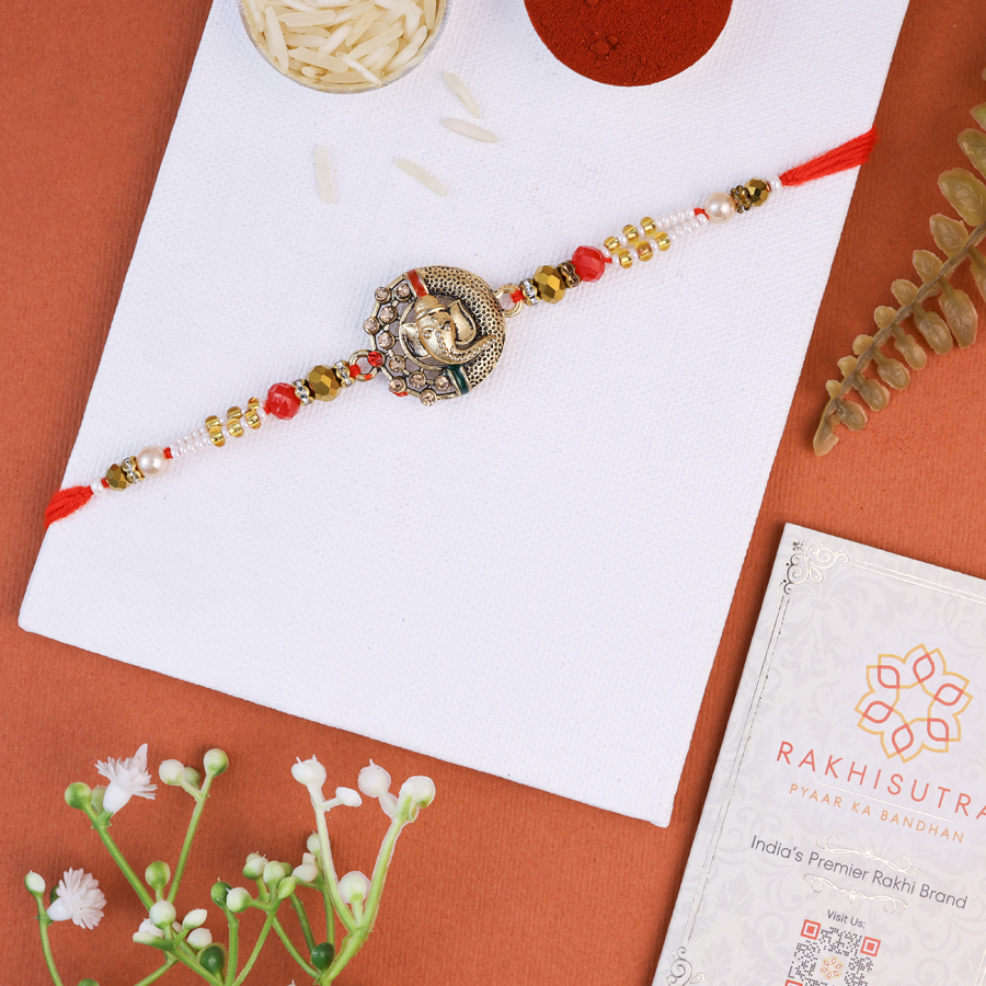 Ganesh Rakhi gift set with Roli Tika and message card 1