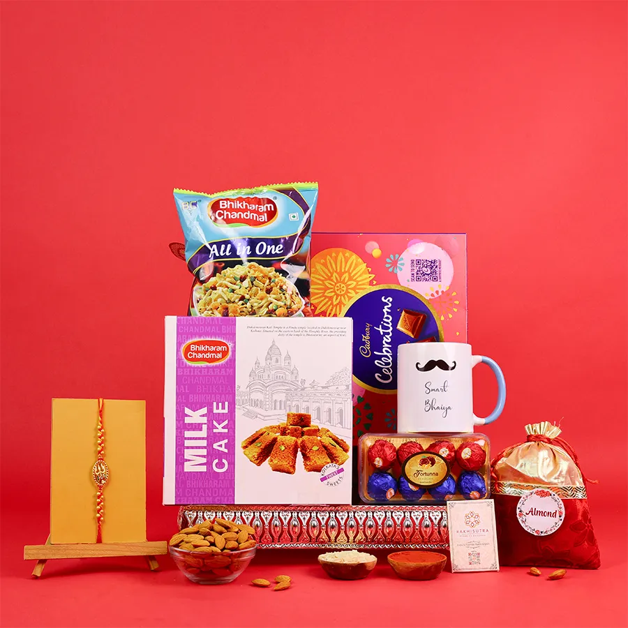Festive Rakhi gift box with sweets and a mug 1