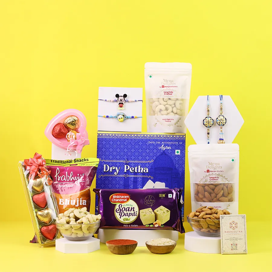 Sweet Rakhi hamper with rakhis and treats 1