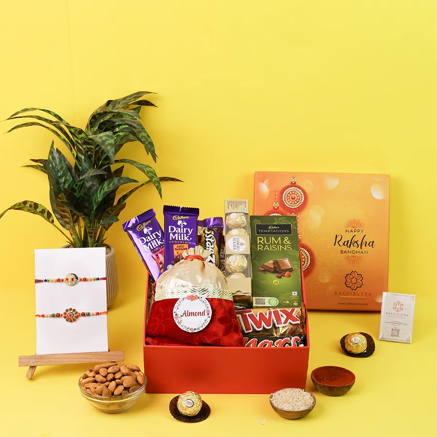 Om and Ganesh Rakhi with assorted chocolates and almonds 1