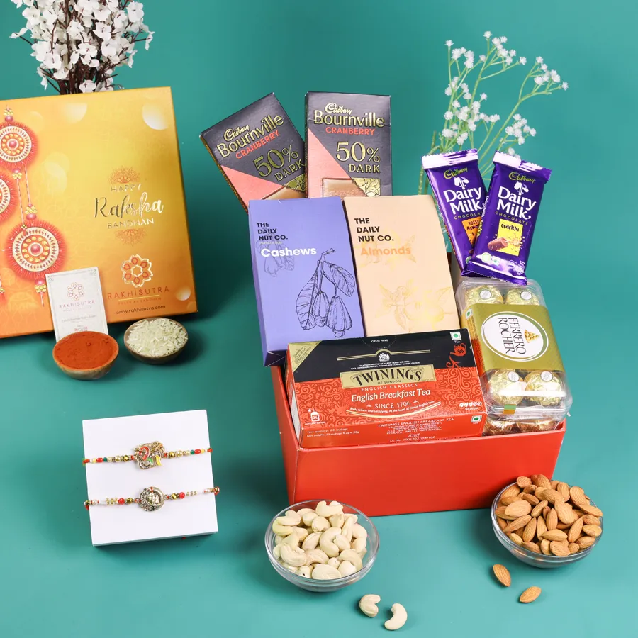 Sacred Rakhi and gourmet treat box with chocolates and nuts 1
